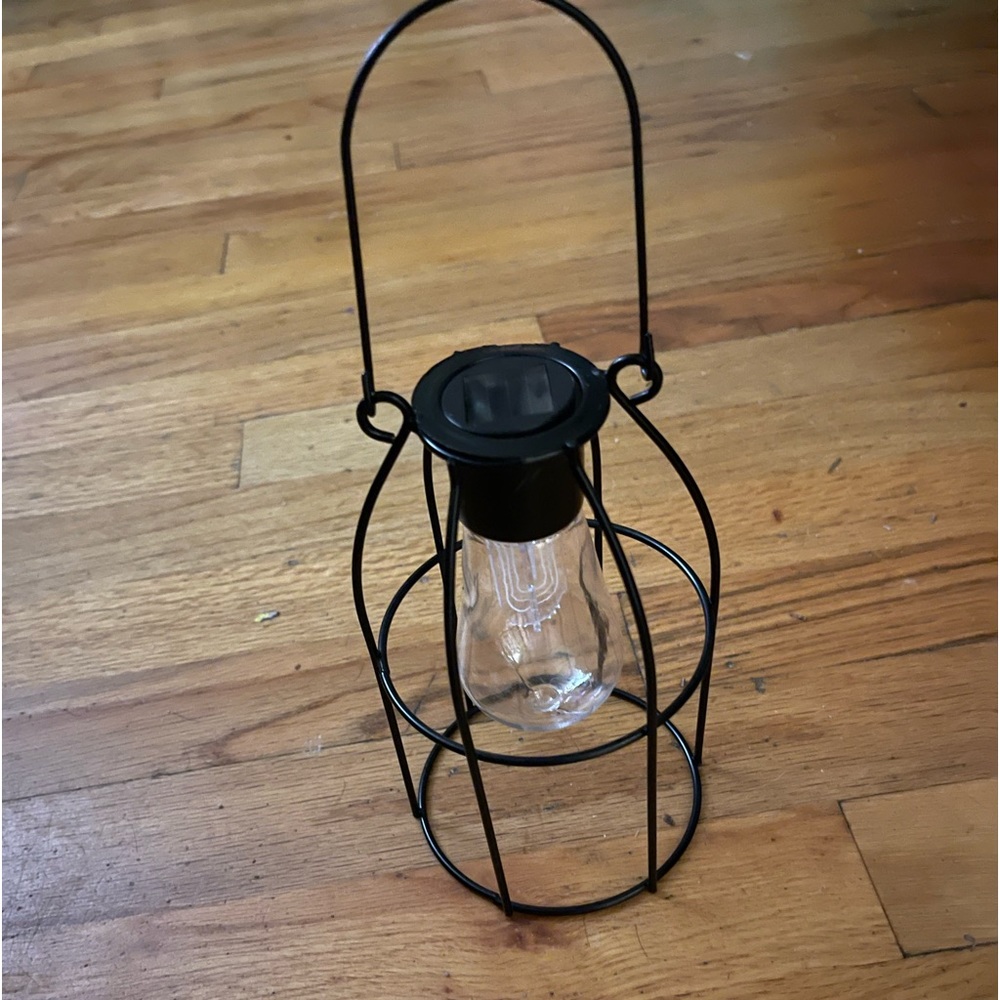 Solar powered hanging metal lantern